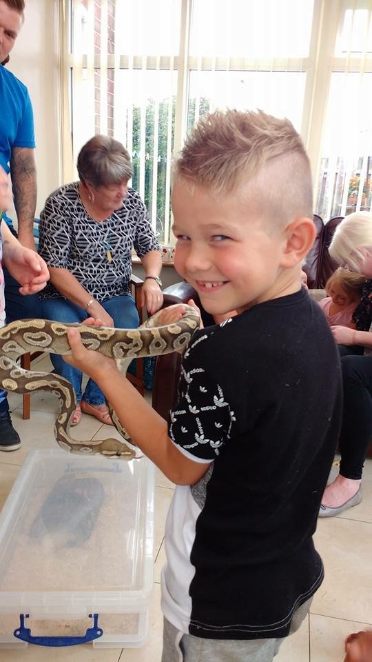 Animal party visit from the ANimal club a boy with python